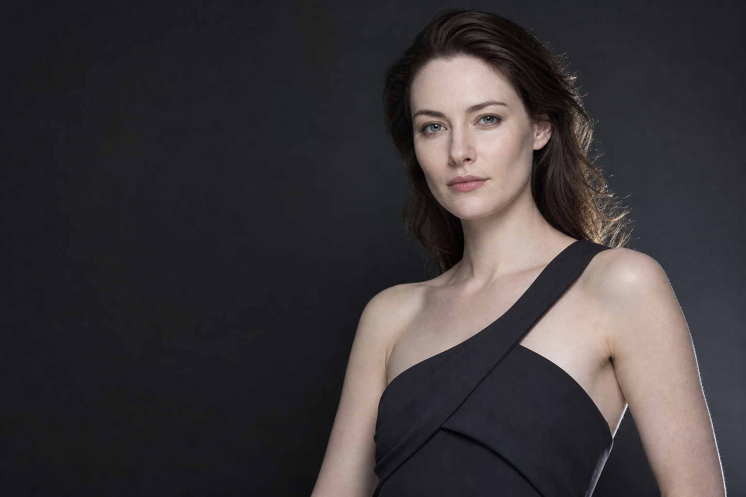 Fair-skinned European woman in a dark editorial portrait